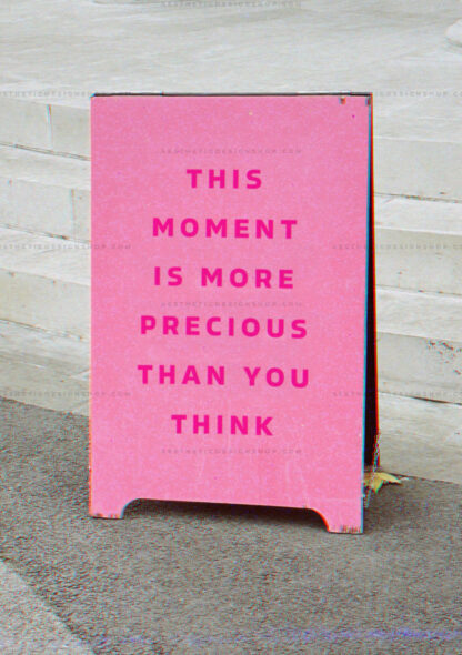 Aesthetic image of sign that reads "This moment is more precious than you think"